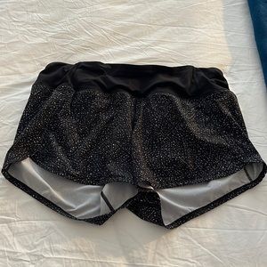 Black and white speckled Lululemon running shorts w/ back zipper & drawstring.